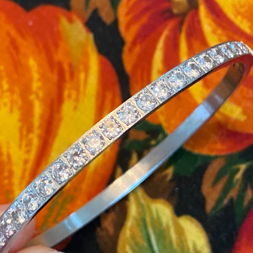 Silvertone Hinged Bangle Accented With Channel Set Rhinestones